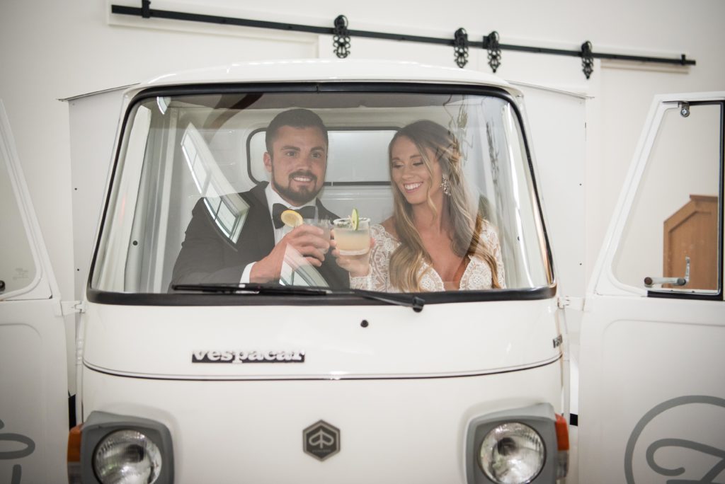 bride and groom having drinks inside Fizzy ATL car
